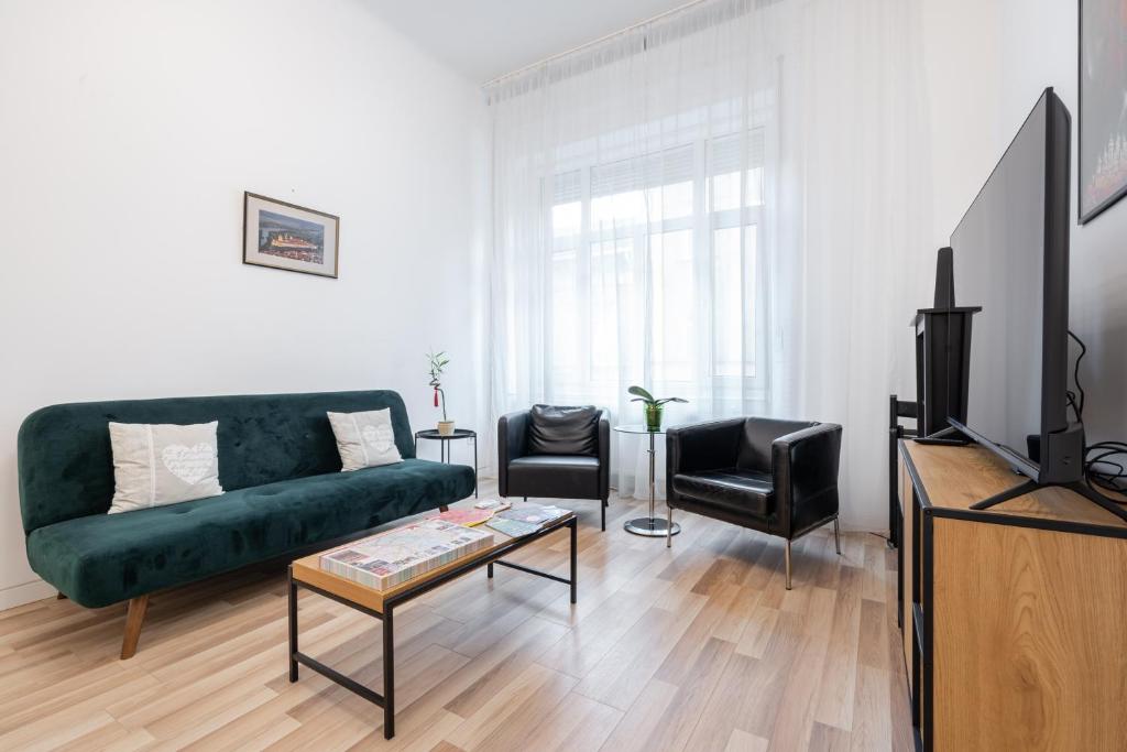 Televízia a/alebo spoločenská miestnosť v ubytovaní Delta Curve Apartment