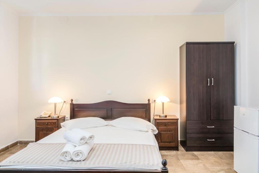 Postel nebo postele na pokoji v ubytování Vergina Star Hotel