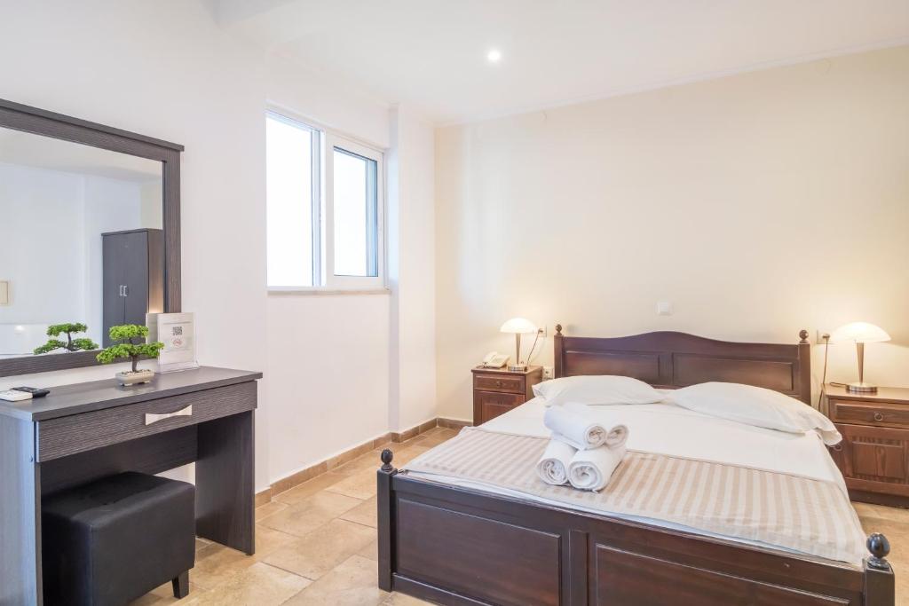 Postel nebo postele na pokoji v ubytování Vergina Star Hotel