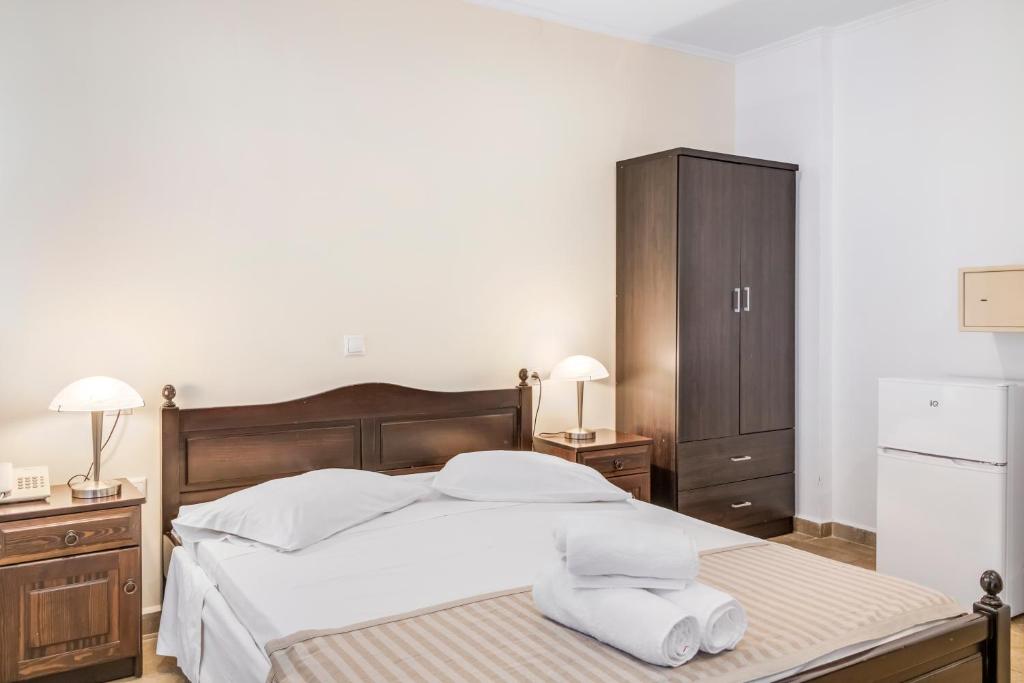 Postel nebo postele na pokoji v ubytování Vergina Star Hotel