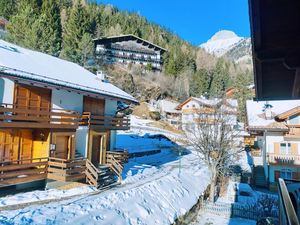 a view of a village in the snow at Cèsa Cherpei - Dog Friendly in Campitello di Fassa