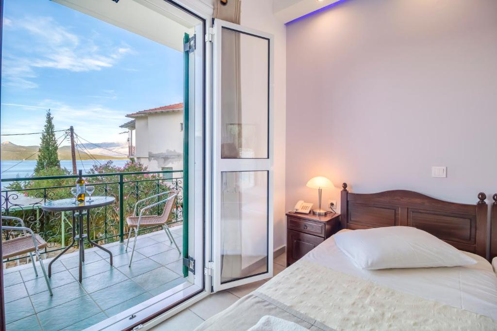 Postel nebo postele na pokoji v ubytování Vergina Star Hotel