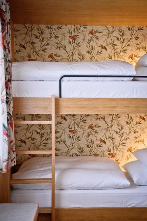 Postel nebo postele na pokoji v ubytování Bachmair Weissach See-Apartments