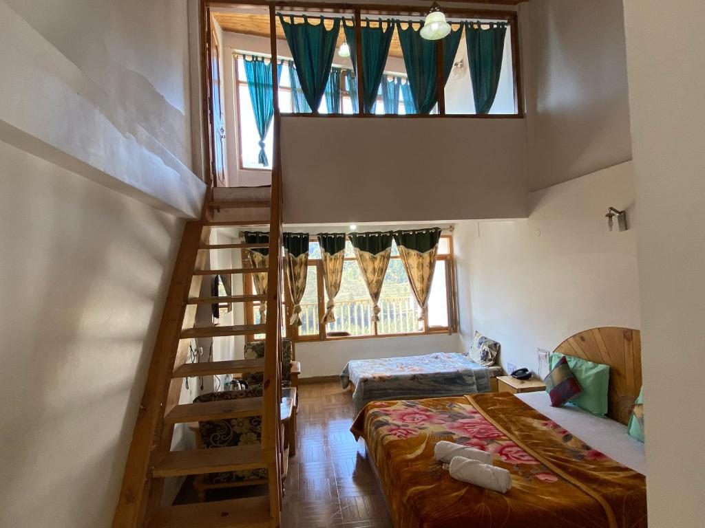 Postel nebo postele na pokoji v ubytování Hotel BHRIGU