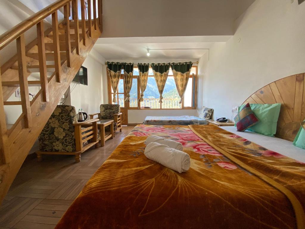 Postel nebo postele na pokoji v ubytování Hotel BHRIGU