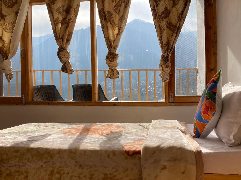 Postel nebo postele na pokoji v ubytování Hotel BHRIGU
