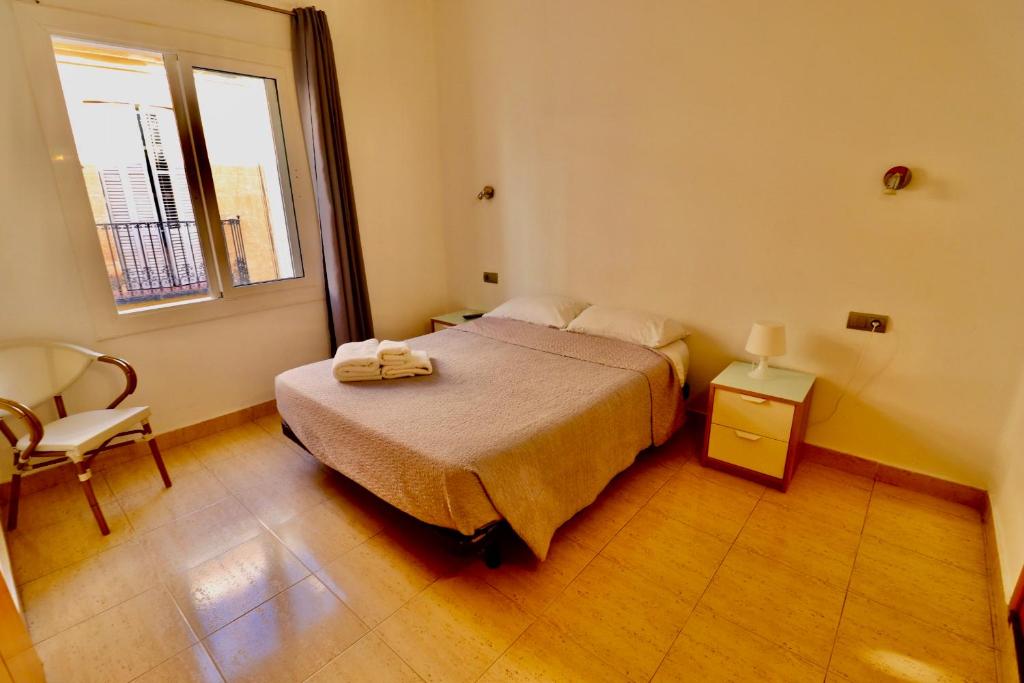 A bed or beds in a room at Hotel Ibiza