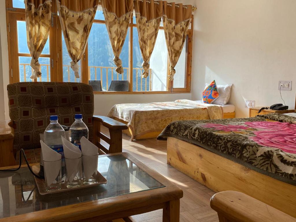 Postel nebo postele na pokoji v ubytování Hotel BHRIGU