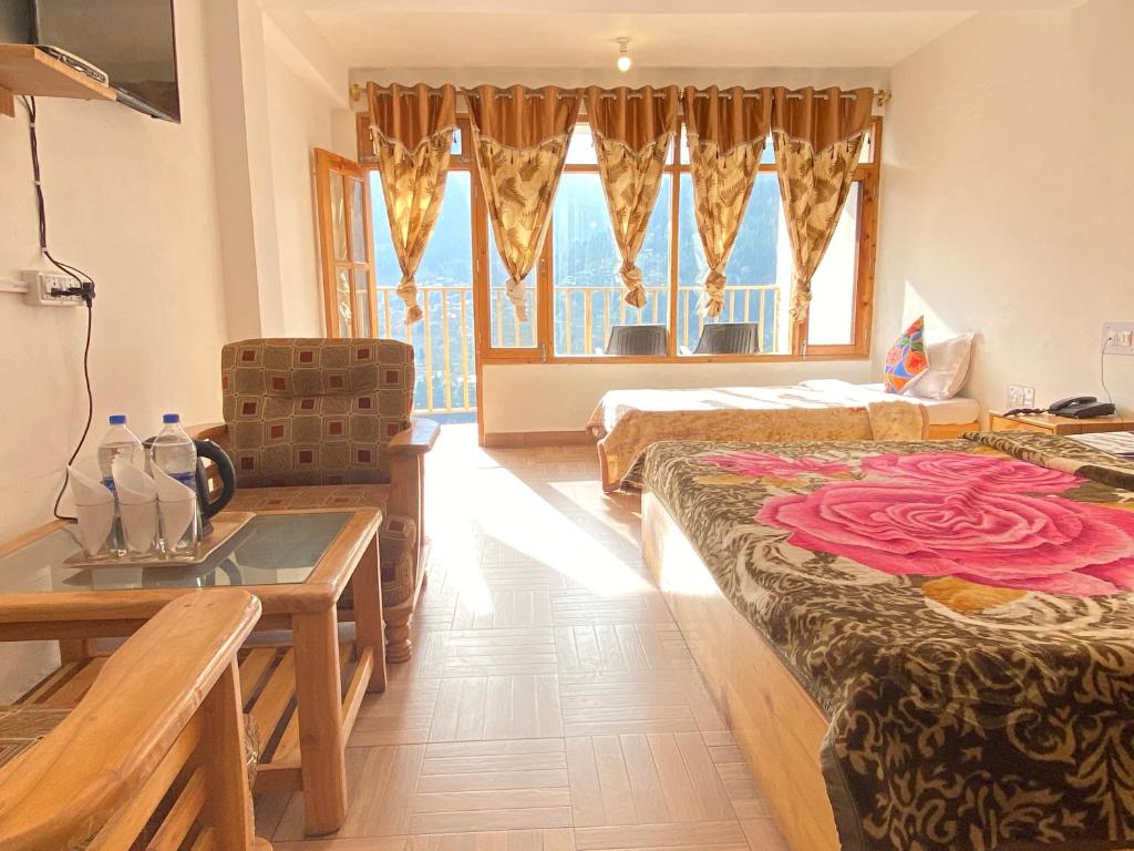 Postel nebo postele na pokoji v ubytování Hotel BHRIGU
