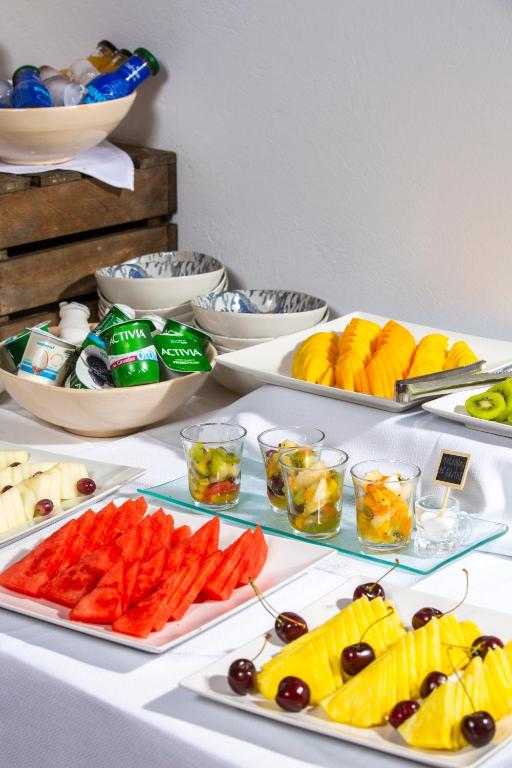 a buffet with different types of fruit and vegetables at Boutique Hotel El Tio Kiko in Agua Amarga