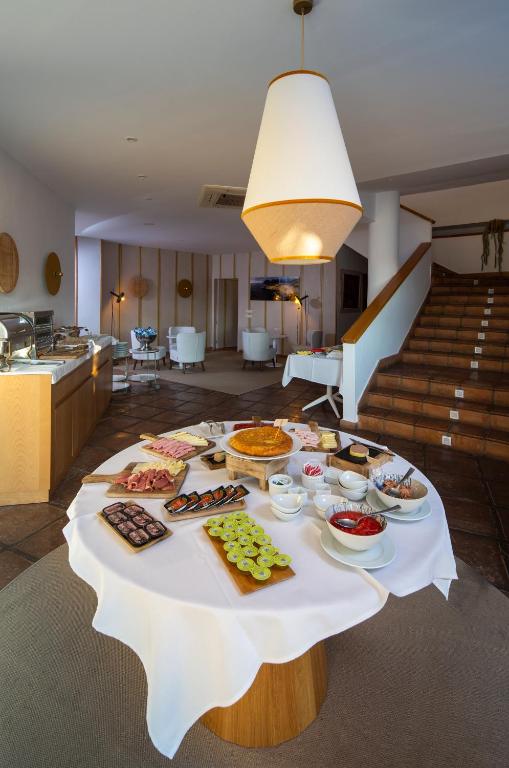 a table with many different types of food on it at Boutique Hotel El Tio Kiko in Agua Amarga