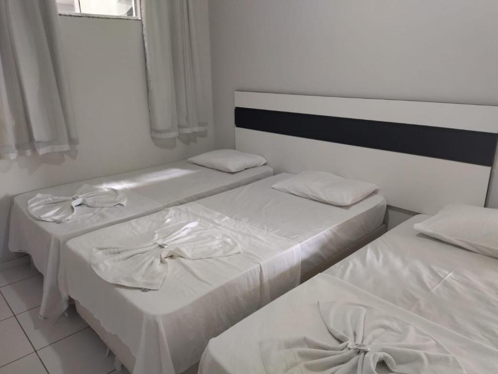 Postel nebo postele na pokoji v ubytování Hotel Caraipe