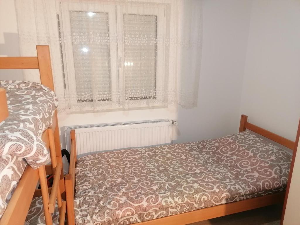 Postel nebo postele na pokoji v ubytování SIMIĆ planinska kuća