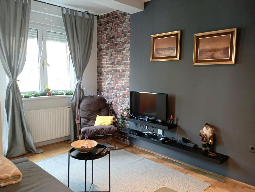 TV i/ili multimedijalni sistem u objektu Sun Center Apartment