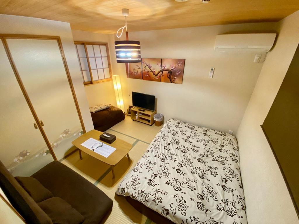 Postel nebo postele na pokoji v ubytování Hotel EL Shinjuku 6
