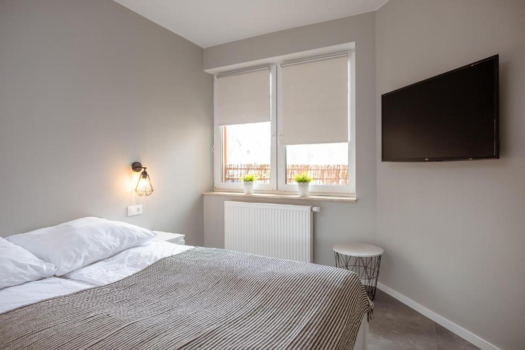 Postel nebo postele na pokoji v ubytování Apartament JANTAR Jagiellońska 6C Darłówko DreamHouse nad morzem