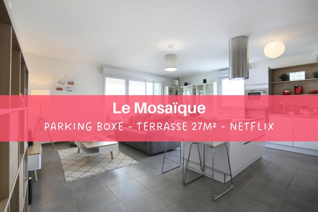 a kitchen with a pink counter in the middle at expat renting - Le Mosaïque - Patte d'Oie - Parking in Toulouse