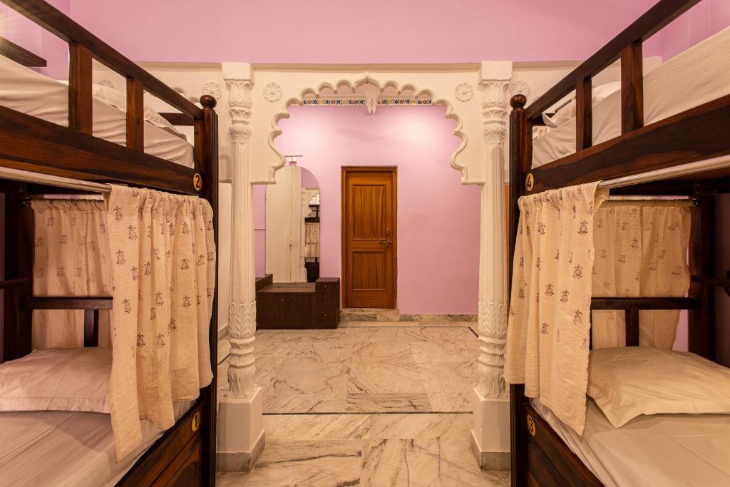 Postel nebo postele na pokoji v ubytování Hostel Mantra