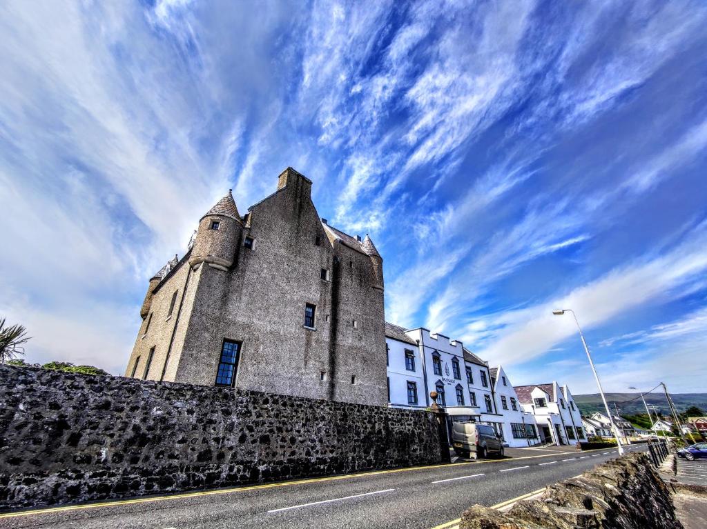 an old building on the side of a street at Ballygally Castle in Larne