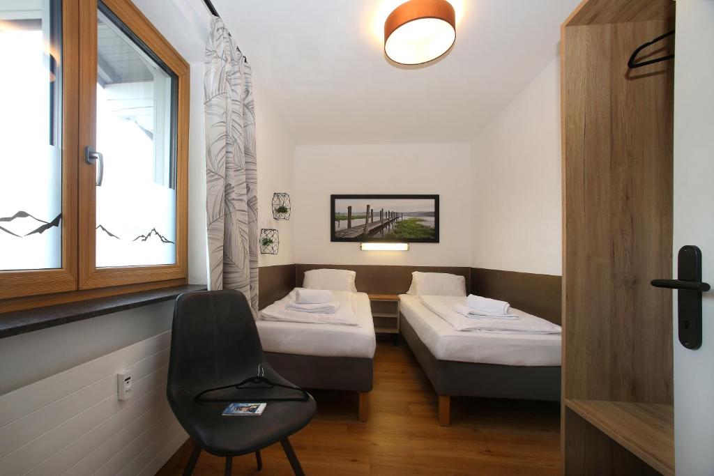 Postel nebo postele na pokoji v ubytování Alm Appartements ZellamSee