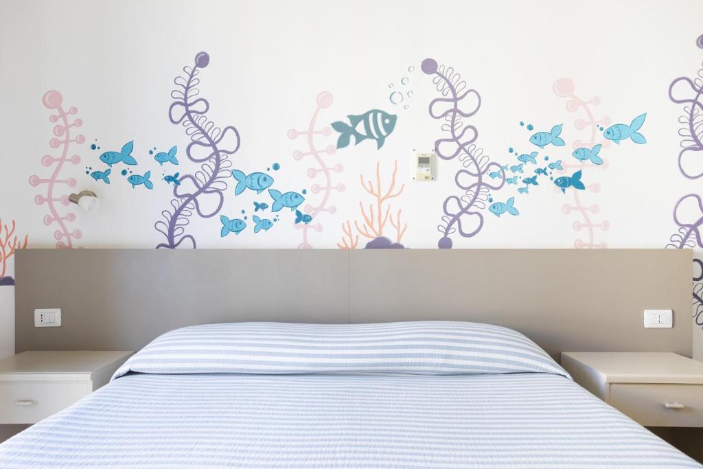 Postel nebo postele na pokoji v ubytování MuMA Hostel