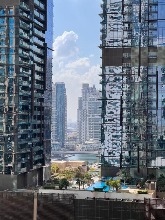 a view of a city with tall buildings at Two Continents Holiday Homes - In the heart of Dubai Marina -Free Airport Pick-up in Dubai