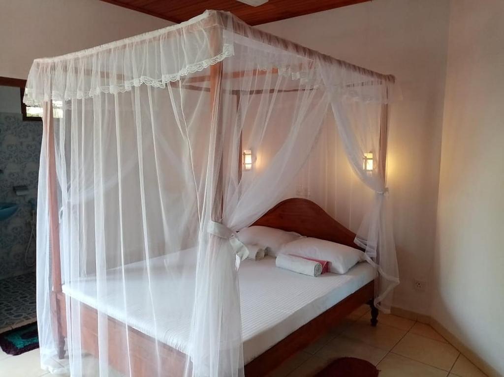Кровать или кровати в номере Best Lanka Holidays
