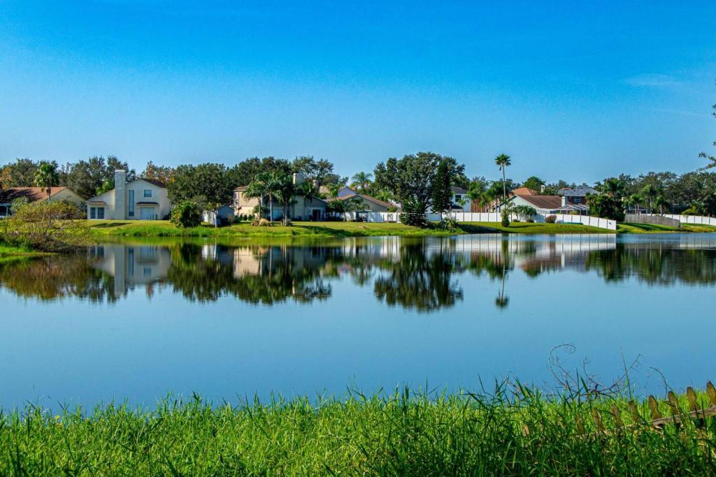 a large body of water with houses in the background at Heather Lakes Retreat in Brandon