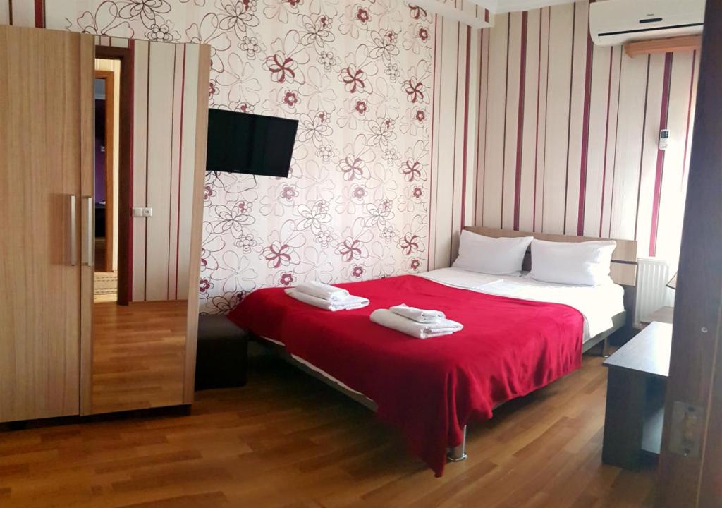 Postel nebo postele na pokoji v ubytování Bonus Inn