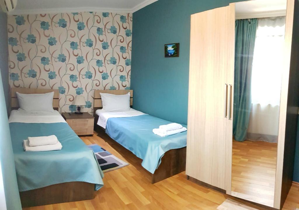 Postel nebo postele na pokoji v ubytování Bonus Inn