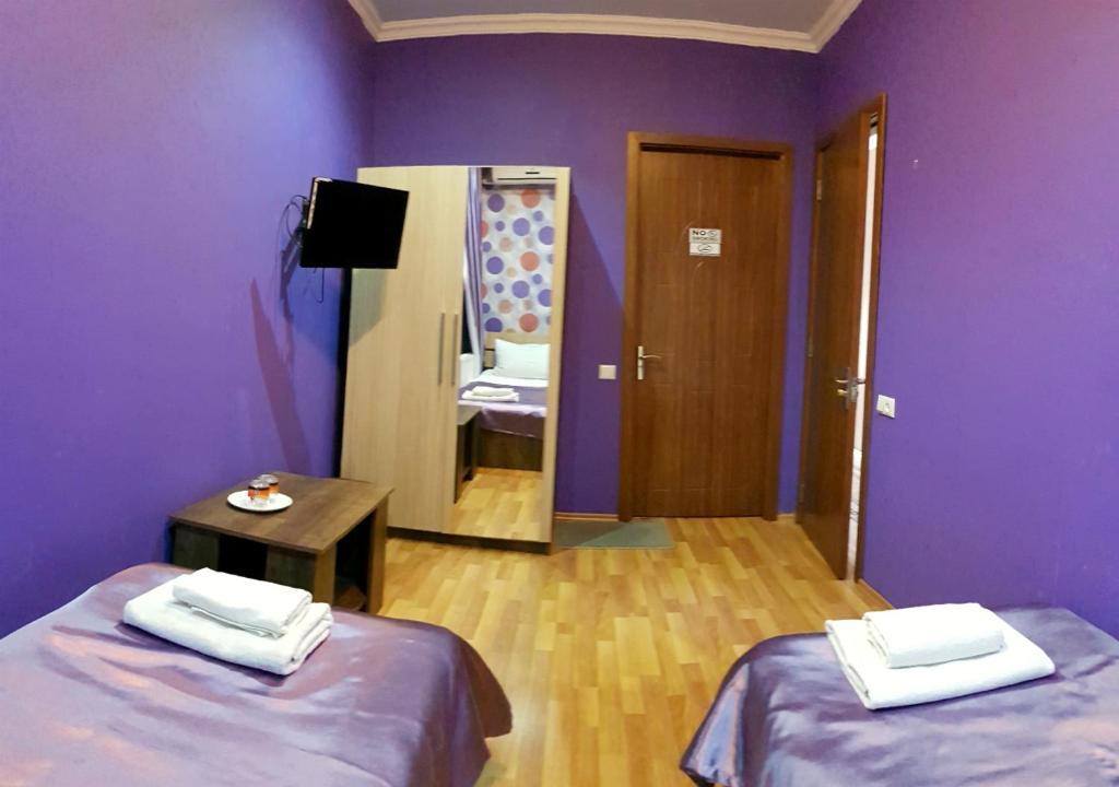 Postel nebo postele na pokoji v ubytování Bonus Inn