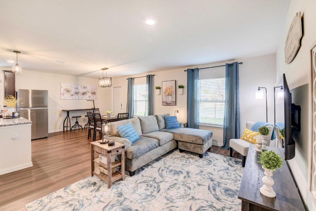 a living room with a couch and a table at Family-Friendly Bellmead Home about 6 Mi to Waco in Bellmead