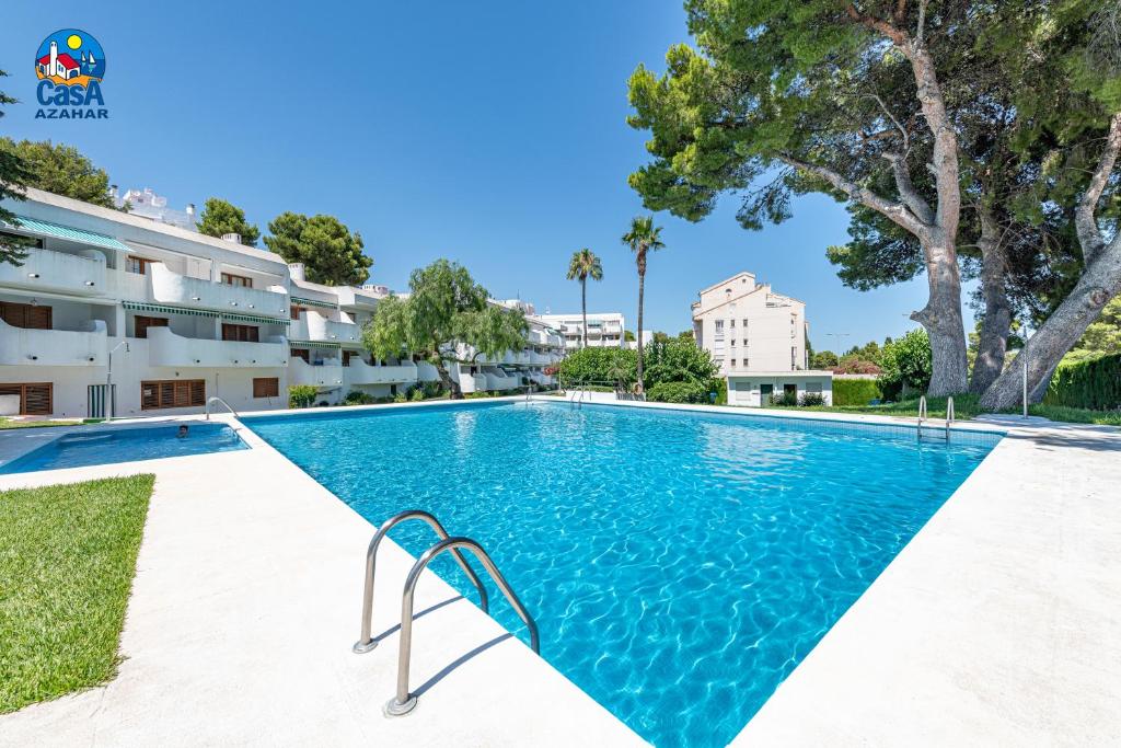 an image of a swimming pool in a building at Apartamentos Arcos II Casa Azahar in Alcossebre