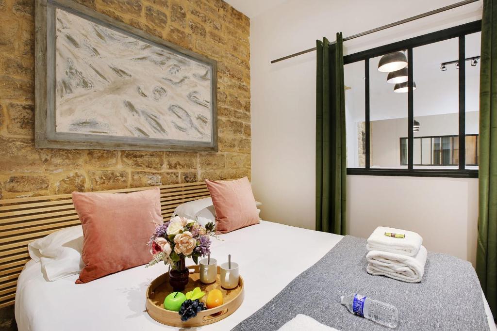 Posteľ alebo postele v izbe v ubytovaní Cosy apartment - 6P-2BR - République