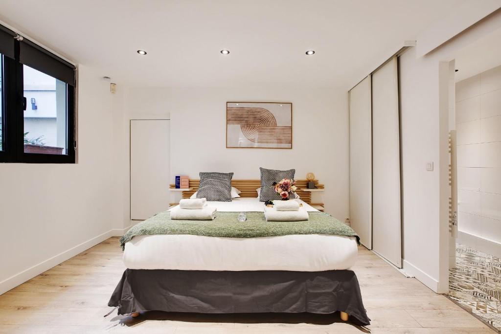Posteľ alebo postele v izbe v ubytovaní Cosy apartment - 6P-2BR - République