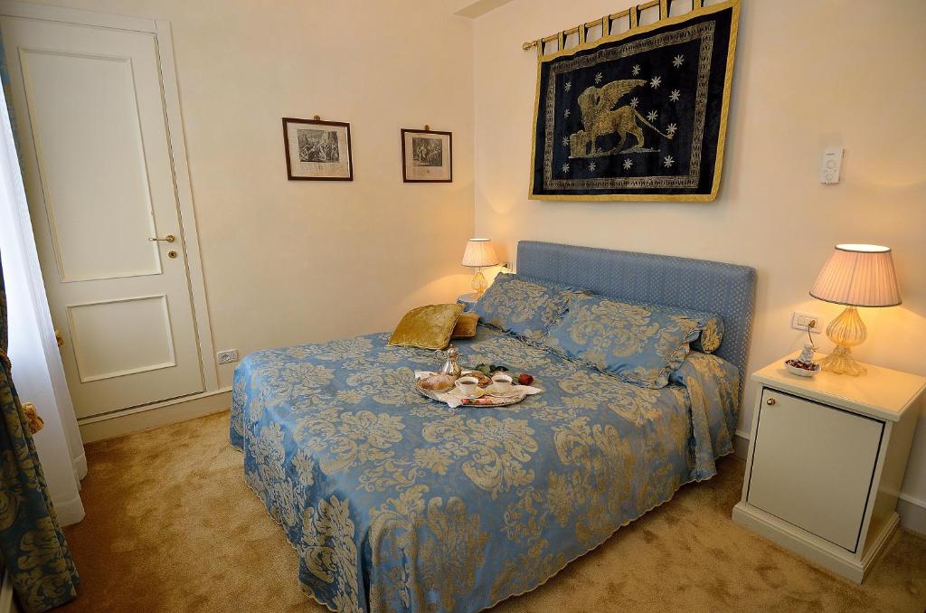Postel nebo postele na pokoji v ubytování Palazzo Odoni
