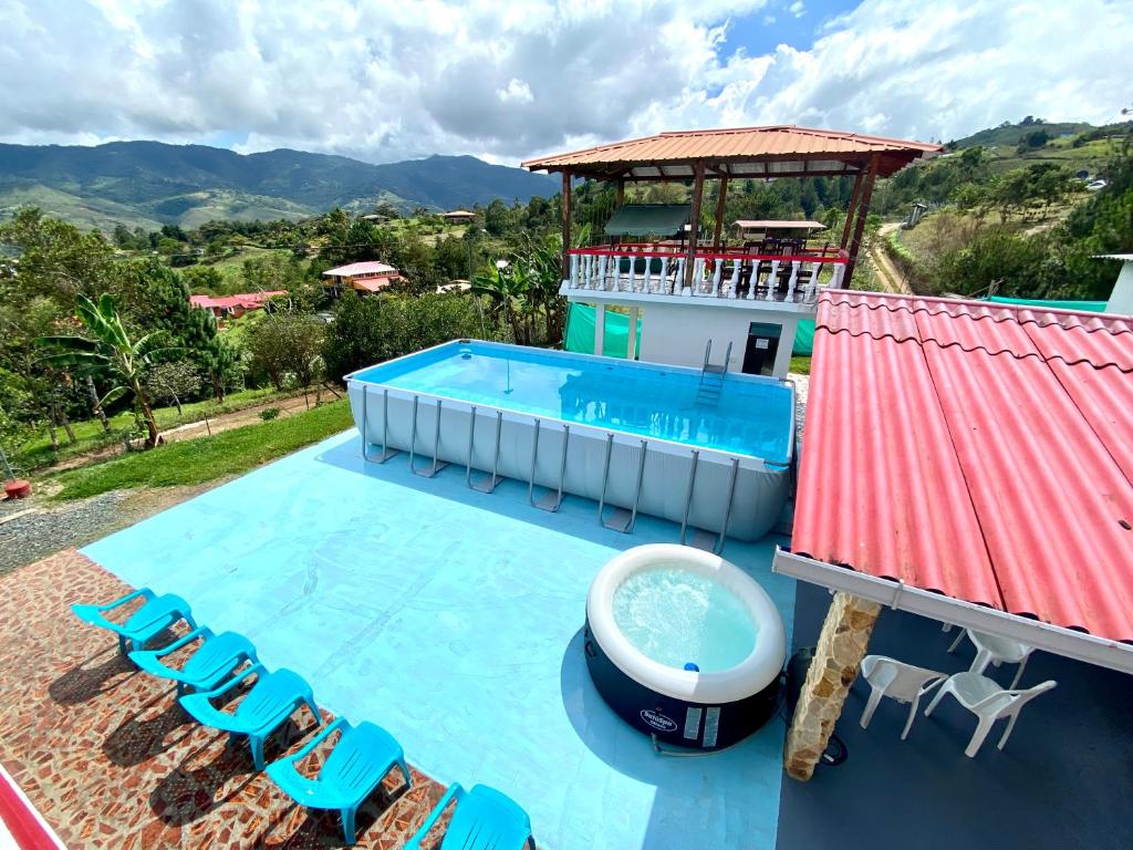 a villa with a swimming pool and a resort at Finca Villa Maju in Papagalleros