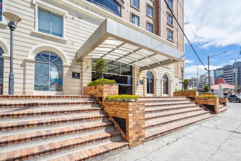 a building with stairs in front of a building at MINI APARTAMENTO, Netflix, Disney Plus, sector privilegiado, cerca de todo in Quito