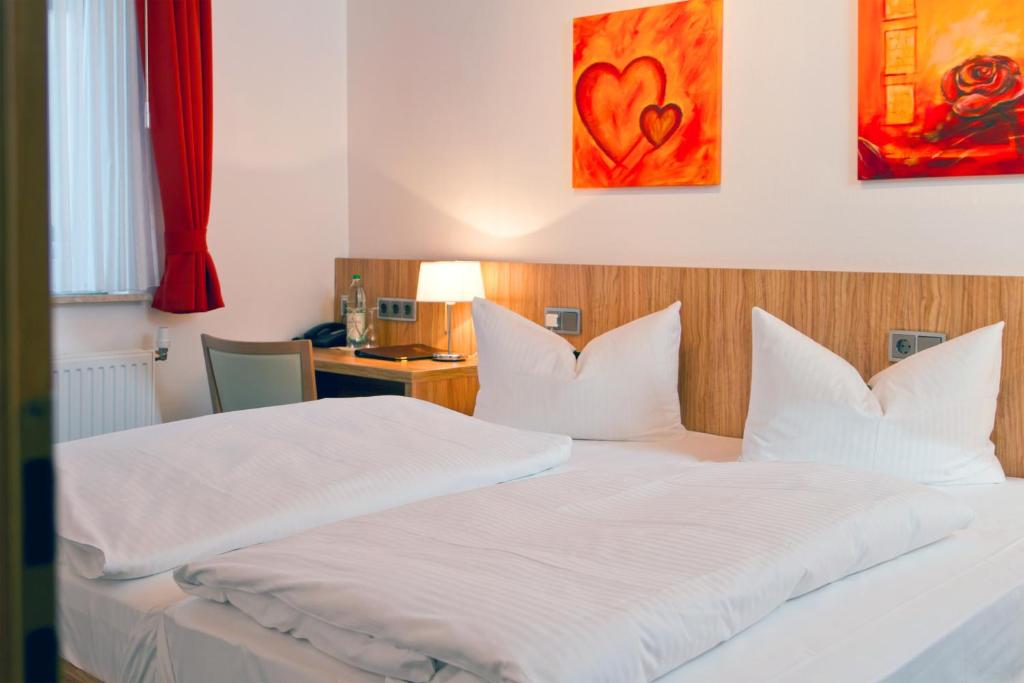 Postel nebo postele na pokoji v ubytování Hotel Schaper