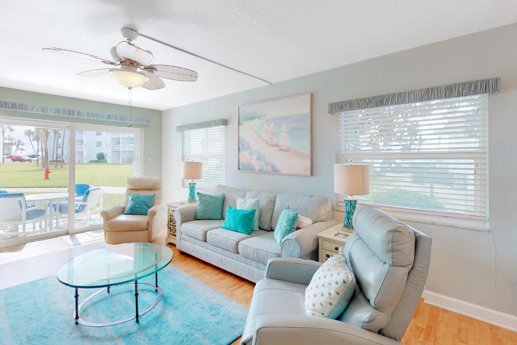 a living room with a couch and a table at El Matador 119 in Fort Walton Beach