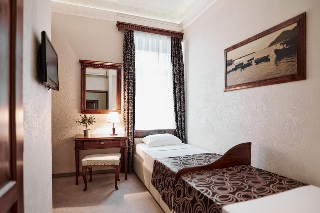 Łóżko lub łóżka w pokoju w obiekcie Hotel Villa Schubert
