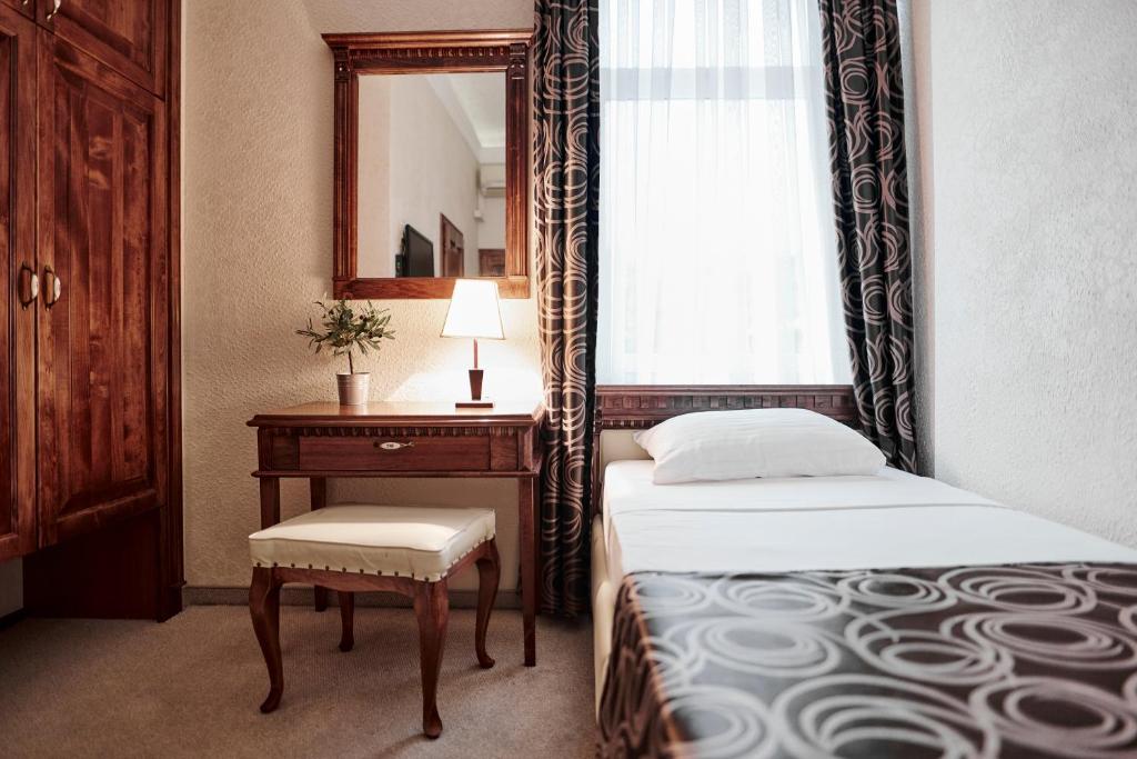 Łóżko lub łóżka w pokoju w obiekcie Hotel Villa Schubert
