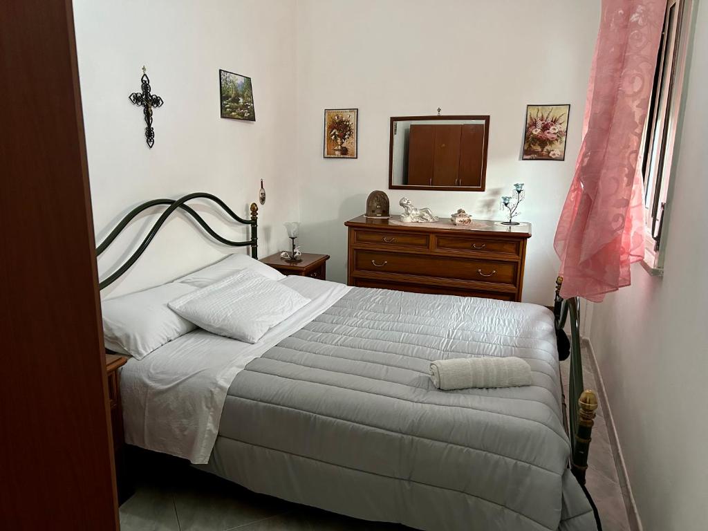 Łóżko lub łóżka w pokoju w obiekcie Aromi di Sicilia Casa Vacanze