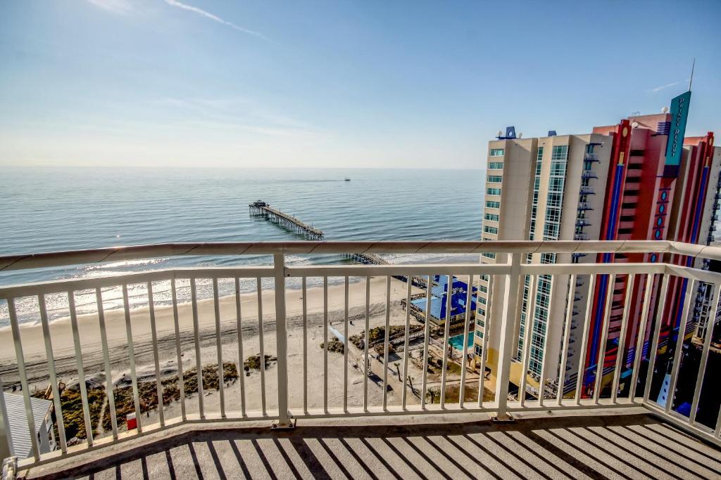 una vista sull'oceano dal balcone di un edificio di Prince Resort Oceanfront 1834 at Cherry Grove Pier a Myrtle Beach