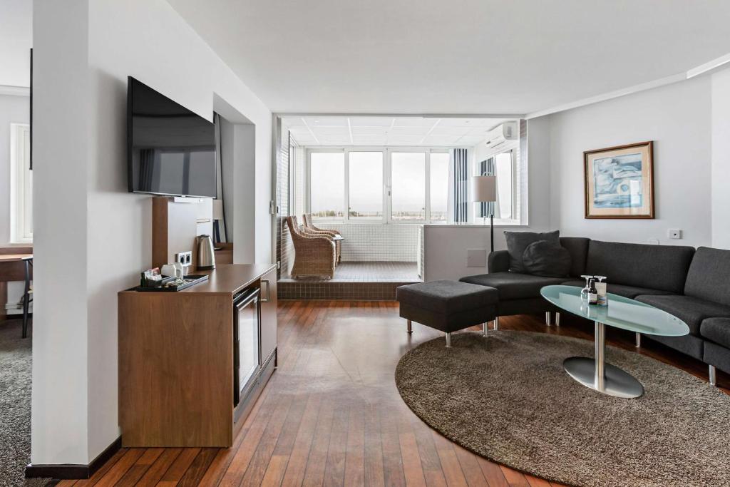 TV a/nebo společenská místnost v ubytování Best Western Hotel Corallen