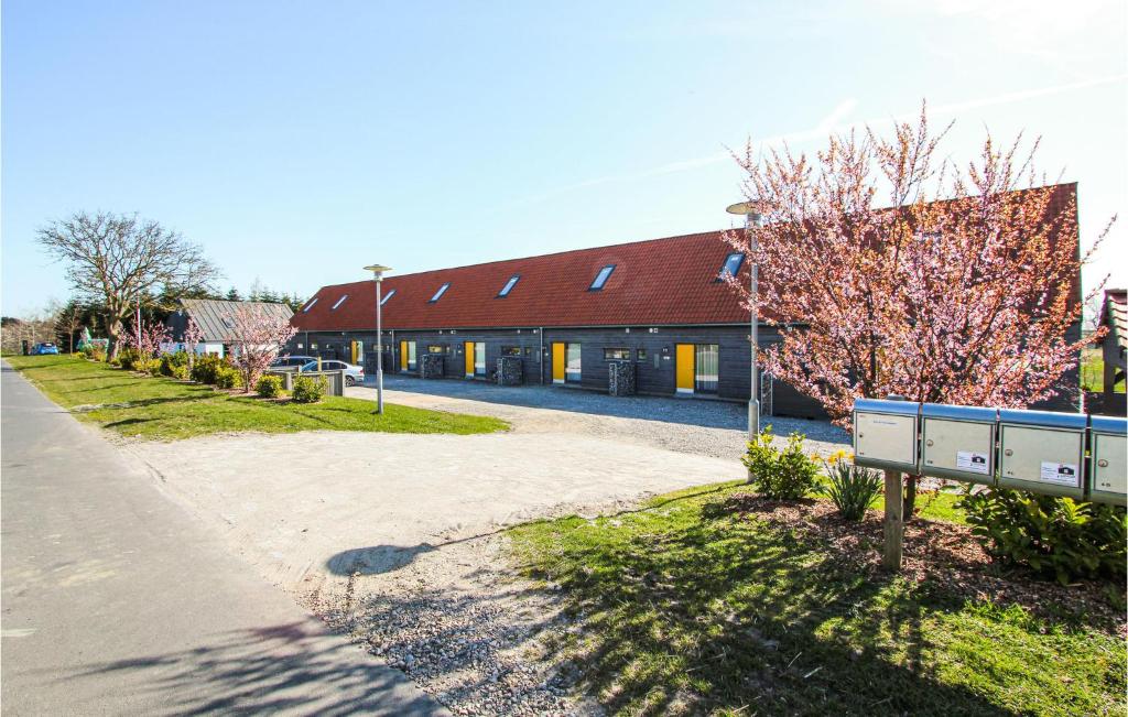 a building with a road in front of it at Gorgeous Apartment In Sams With Kitchen in Onsbjerg