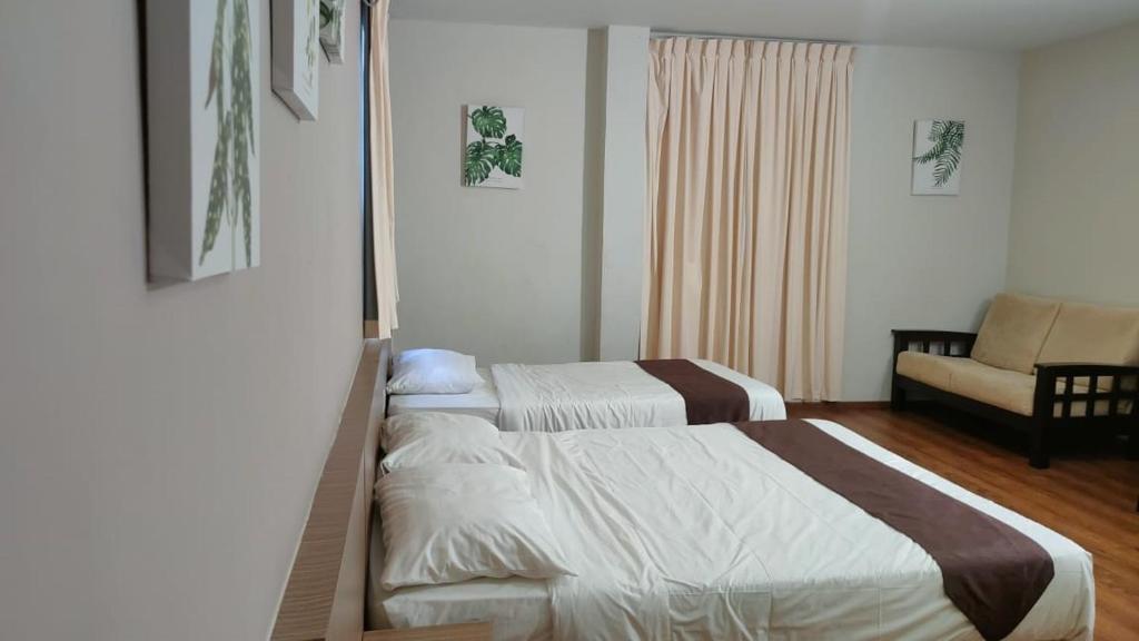 Postel nebo postele na pokoji v ubytování Yew Hotel