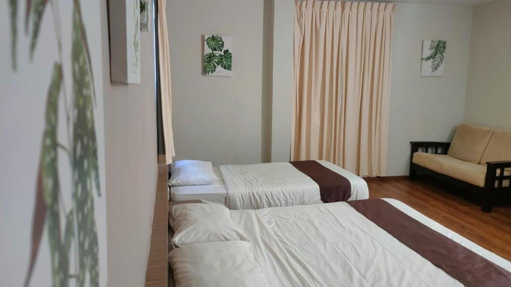 Postel nebo postele na pokoji v ubytování Yew Hotel
