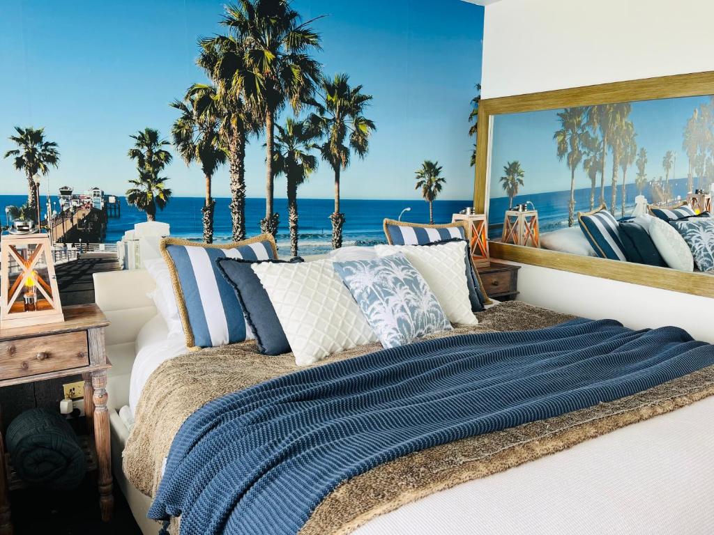 a bedroom with a bed with palm trees in the background at Lorne World in Lorne