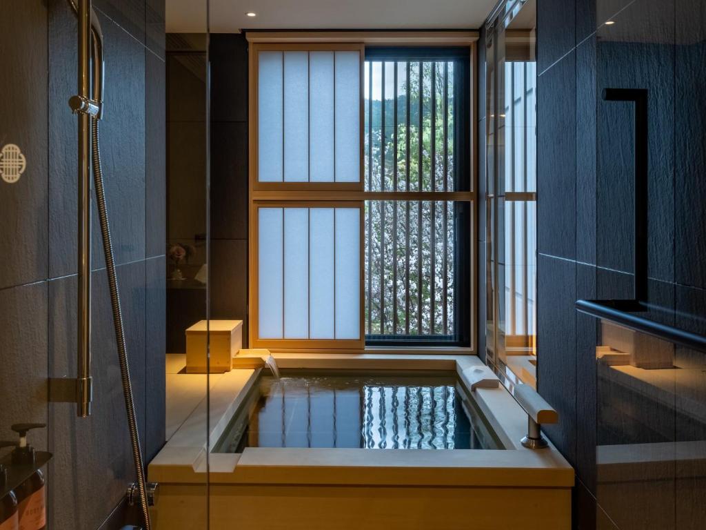 Postel nebo postele na pokoji v ubytování Fufu Kyoto